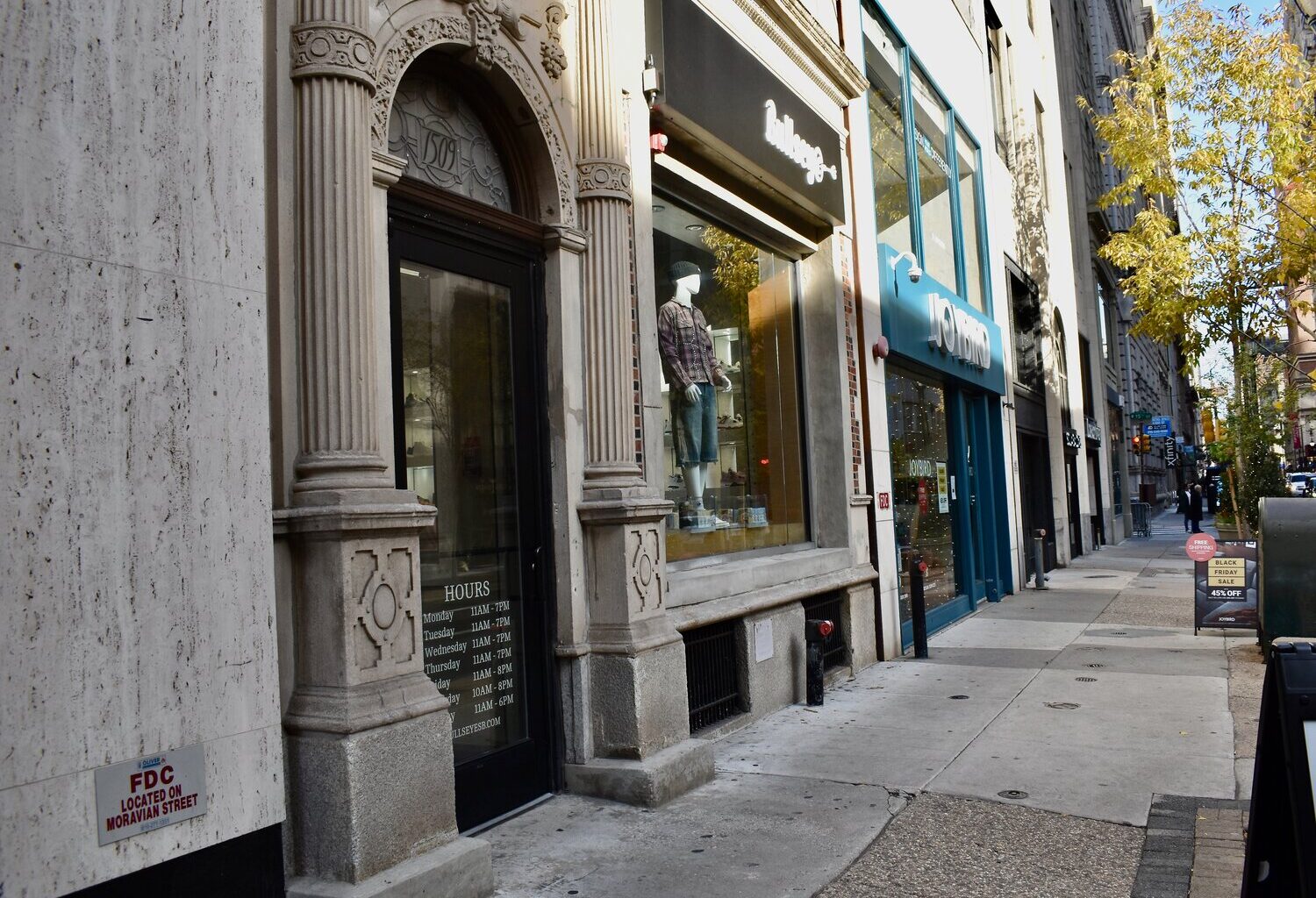 Storefronts dot Walnut Street in Center City on Monday, Nov. 24, 2025.