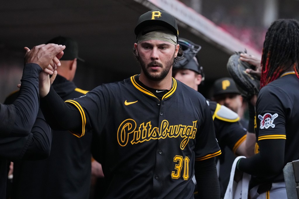 Paul Skenes #30 of the Pittsburgh Pirates celebrates with teammates prior to a baseball game against the Cincinnati Reds at Great American Ball Park on September 24, 2025 in Cincinnati, Ohio. 