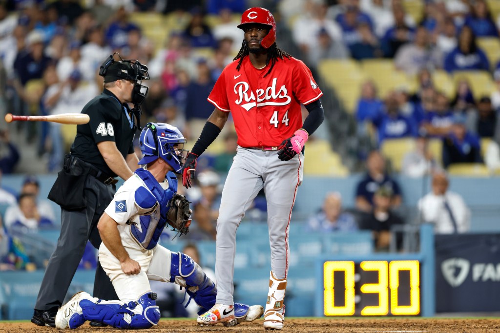  Elly De La Cruz #44 of the Cincinnati Reds flips his bat after being walked to score Miguel Andujar #38 during the eighth inning against the Los Angeles Dodgers in game one of the National League Wild Card Series at Dodger Stadium on September 30, 2025 in Los Angeles, California. 