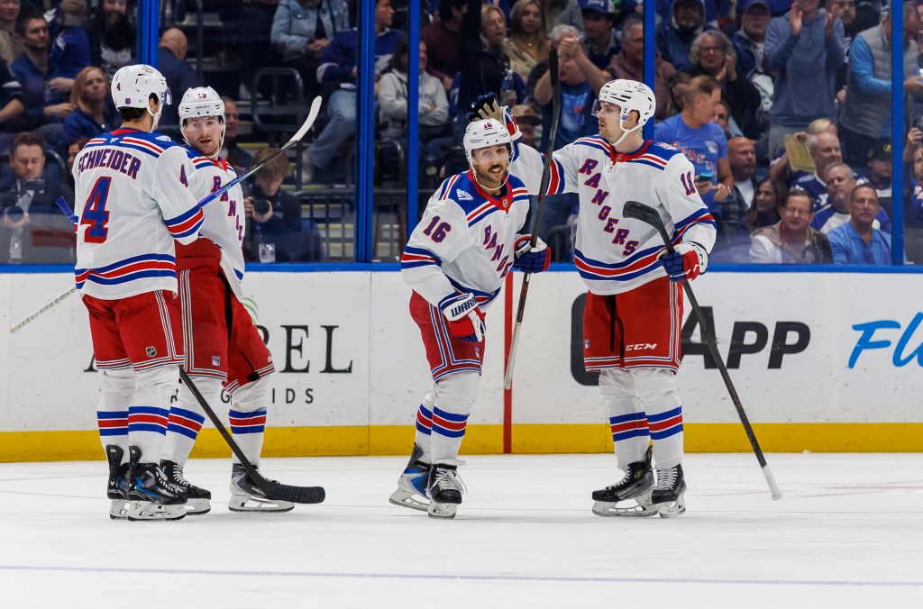 Vincent Trocheck (16) celebrates with teammates after scoring a goal during the Rangers' 7-3 blowout road win over the Lightning on Nov. 12, 2025.