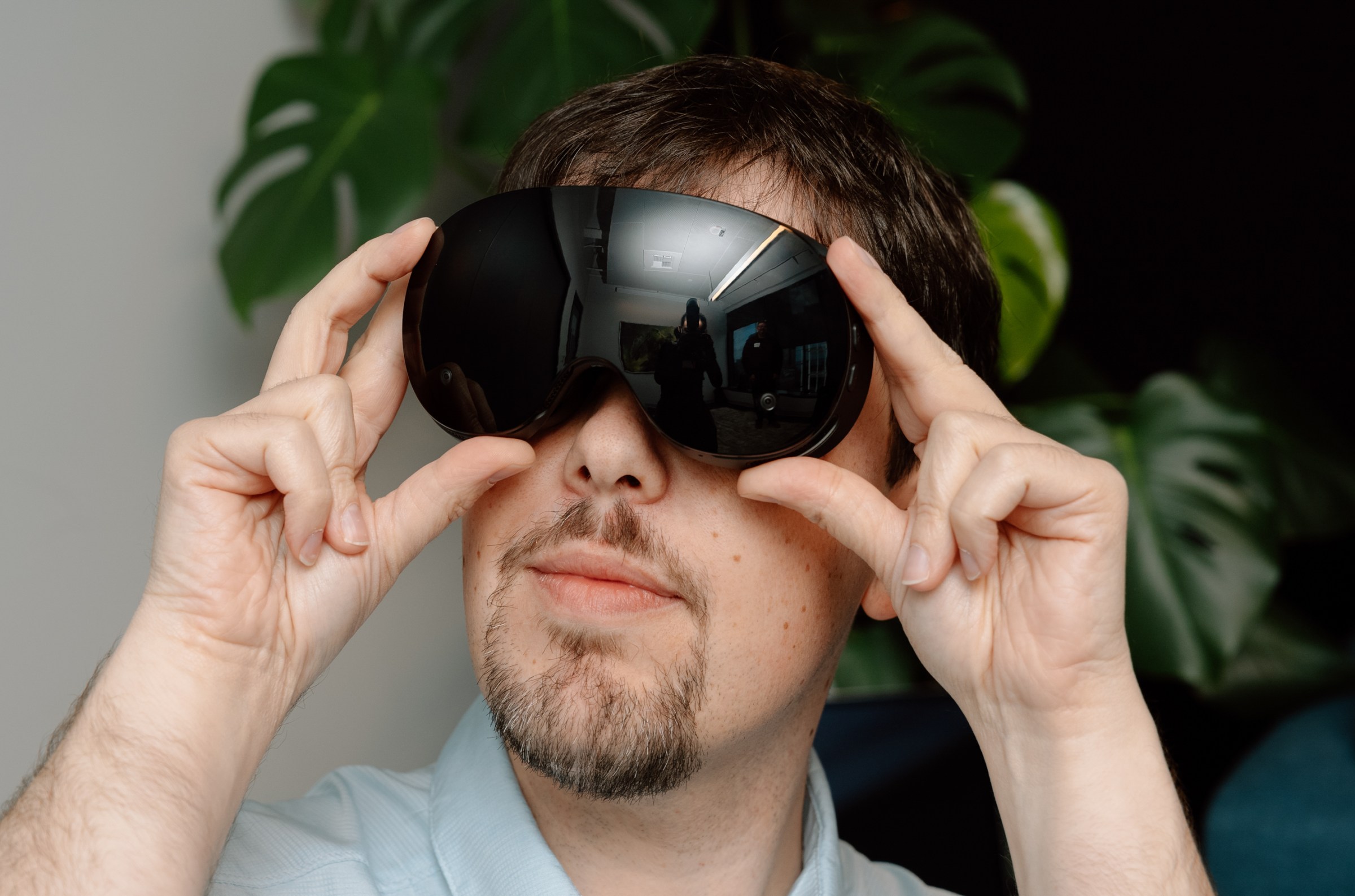 Sean is holding up the lenses in front of his face.