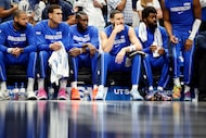 Dallas Mavericks guard Klay Thompson (seated, second from right) sat on the bench during the...