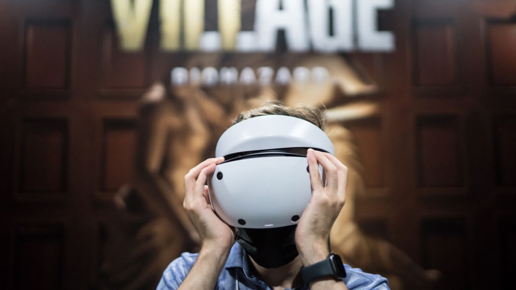 An attendee wears a Sony PlayStation VR2 (PS VR2) headset to play the Biohazard Village, known as Resident Evil Village outside of Japan, video game in the Capcom booth at the Tokyo Game Show 2022 on September 15, 2022, in Chiba, Japan.
