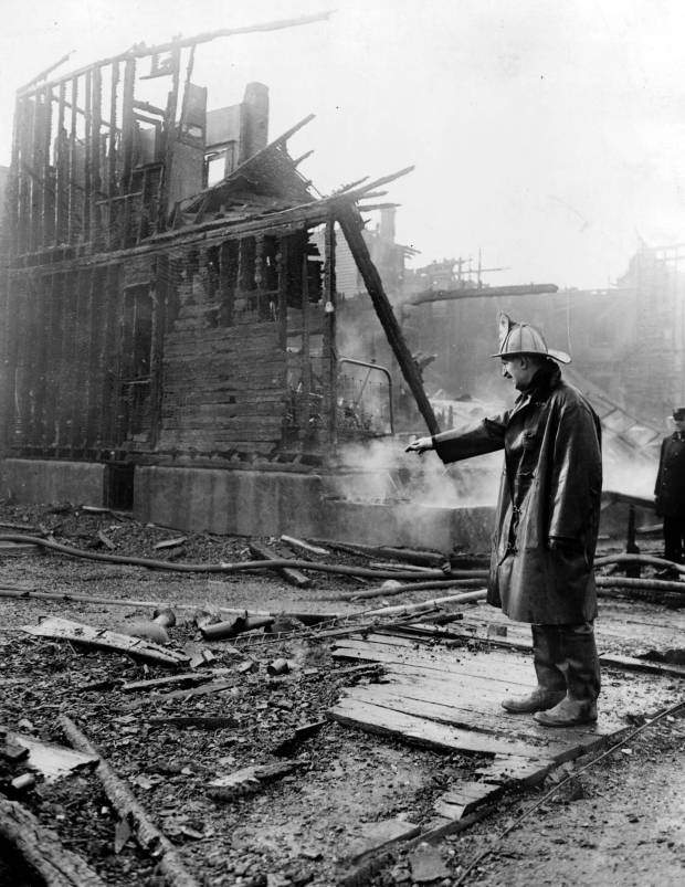 A firefighter looks over a burned-out building during the Chicago...
