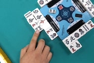 Learn to play mahjong, from bams to dots to cracks, or hone your game at these places in...