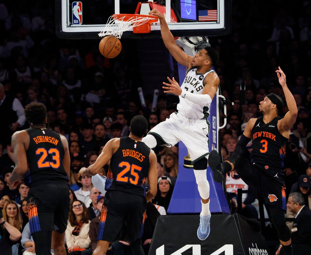 Giannis Antetokounmpo dunks the ball in a game between the Milwaukee Bucks and New York Knicks.