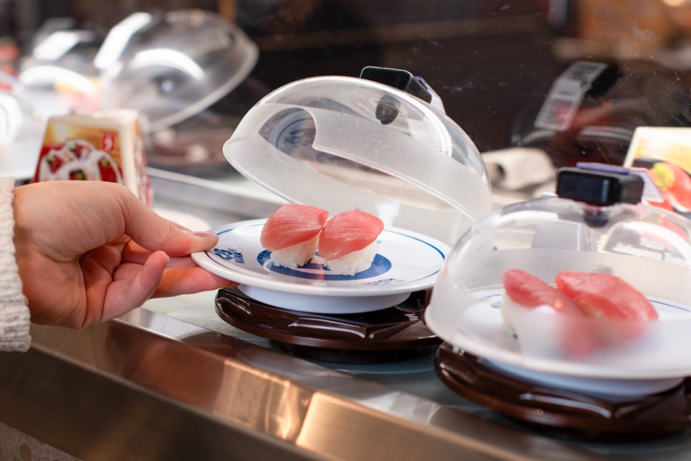 Dishes at Kura Revolving Sushi Bar are served on a revolving conveyor belt.