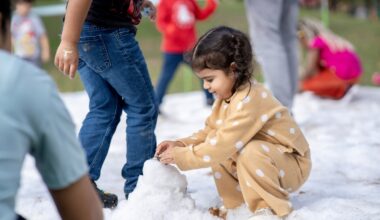 a young girl playing in snow