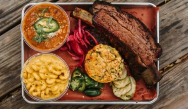 A plate of food with brisket and sides