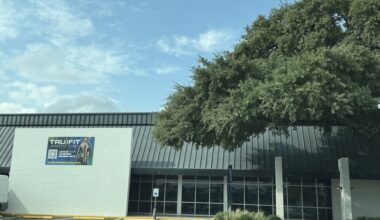 The exterior of a gym getting ready to open to the public.