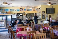 Customers order food and eat in the dining room of Elaine’s Kitchen on Tuesday, Oct. 14,...