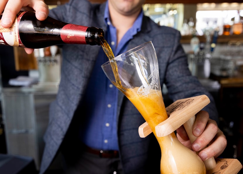 Owner Jeff Karetnick pours Kwak Pale Ale into a glass at Meyboom Brasserie in 2022. It...