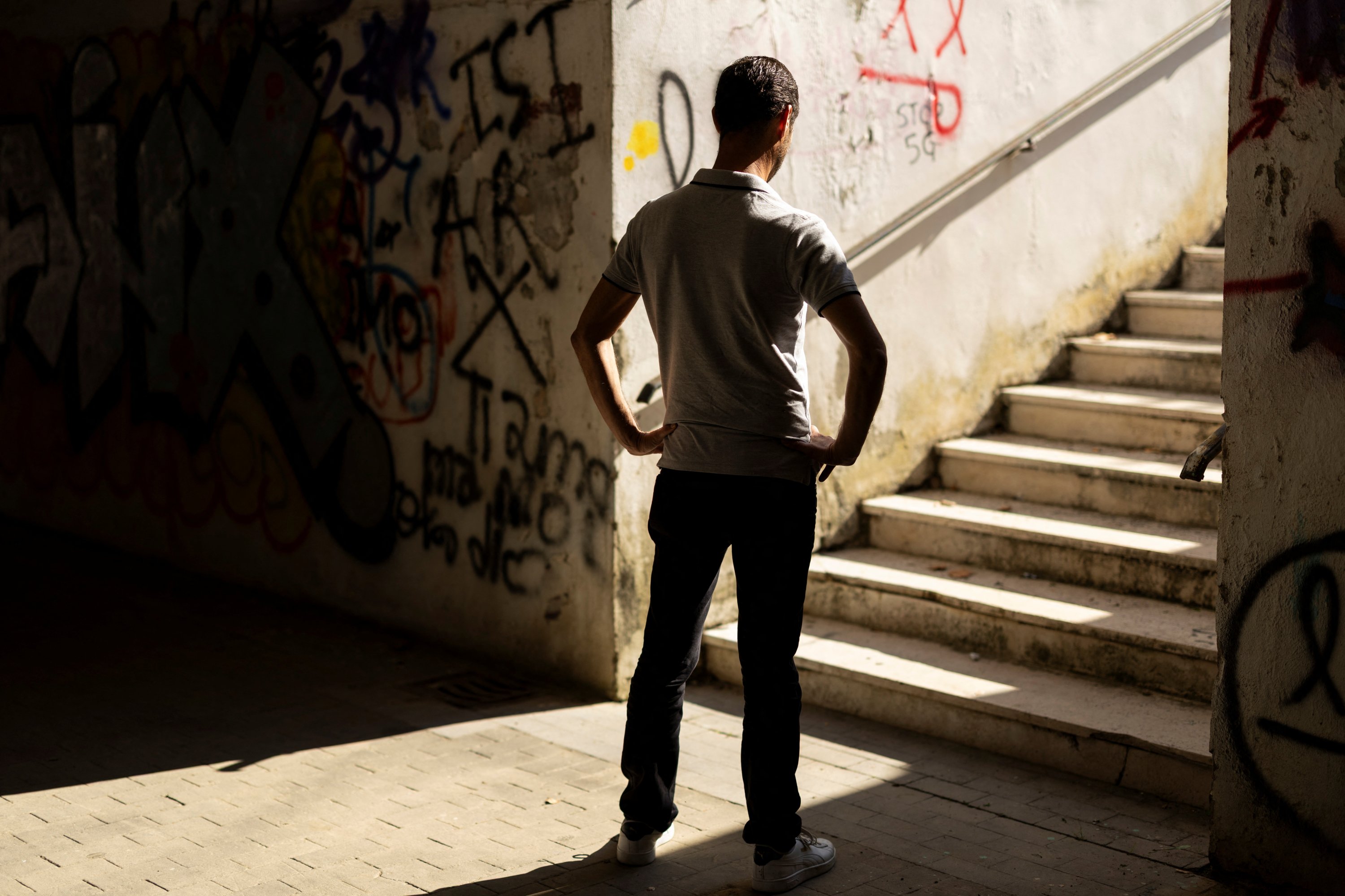 Giovanni, a former gambling addict, waits to be interviewed by Reuters in Pisa, Italy, Oct. 15, 2025. REUTERS/Remo Casilli. He requested that his name be changed and his face concealed to protect his privacy.