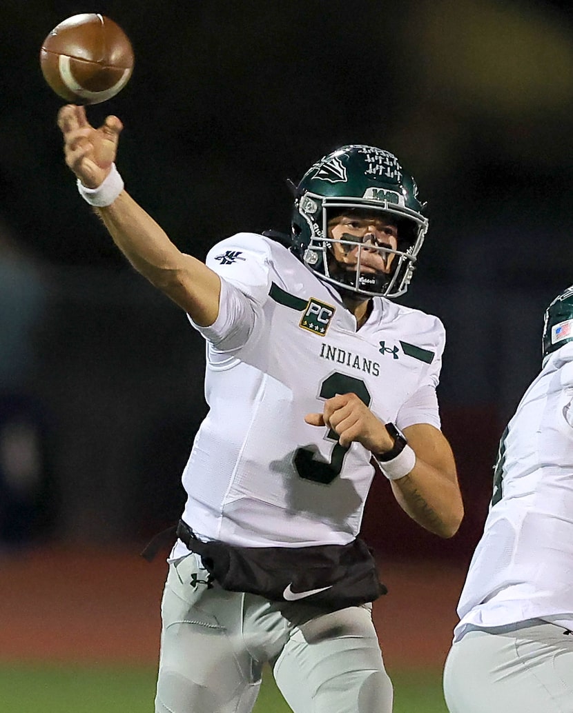 Waxahachie quarterback Jerry Meyer III attempts a pass against Lancaster during the first...