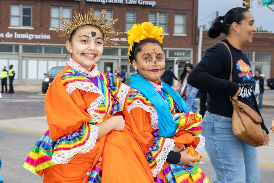 Parade participants walk down Main Street for the Día De Los Muertos Parade in Northside Fort Worth on Saturday, Nov. 1, 2025.