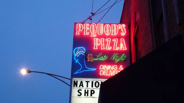Pequod's Pizzeria sign at dusk