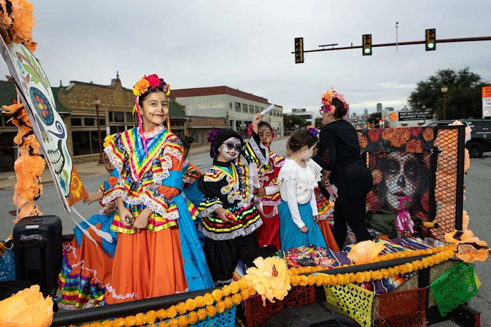Parade participants ride in their float on Main Street for the Día De Los Muertos Parade in Northside Fort Worth on Saturday, Nov. 1, 2025.