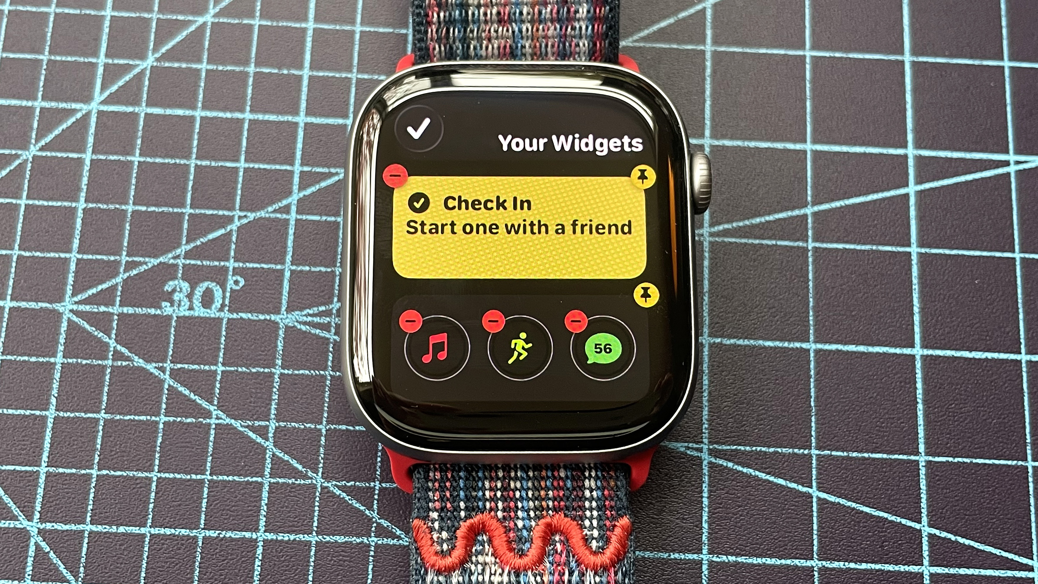 Detail shot of an Apple Watch Series 11 showing the steps to set up and send a Check In safety notification in watchOS 26