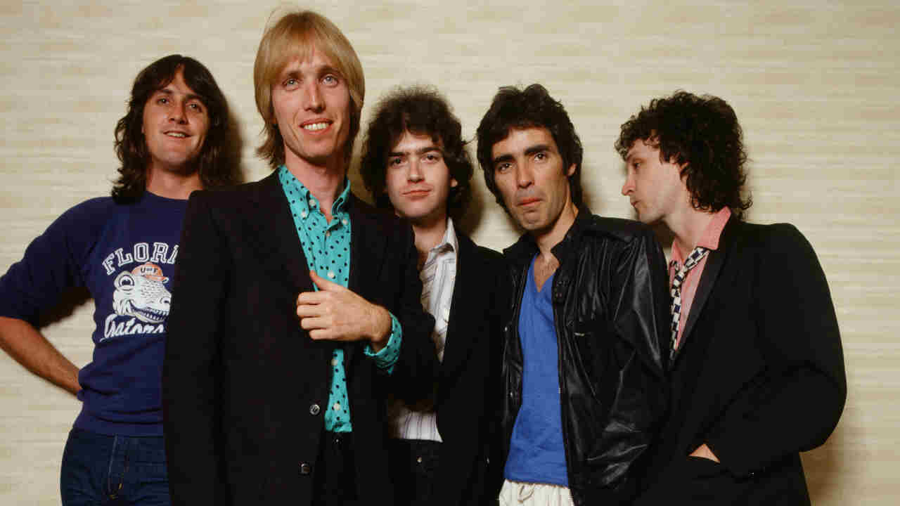 Tom Petty &amp; The Heartbreakers posing for a photograph in 1980