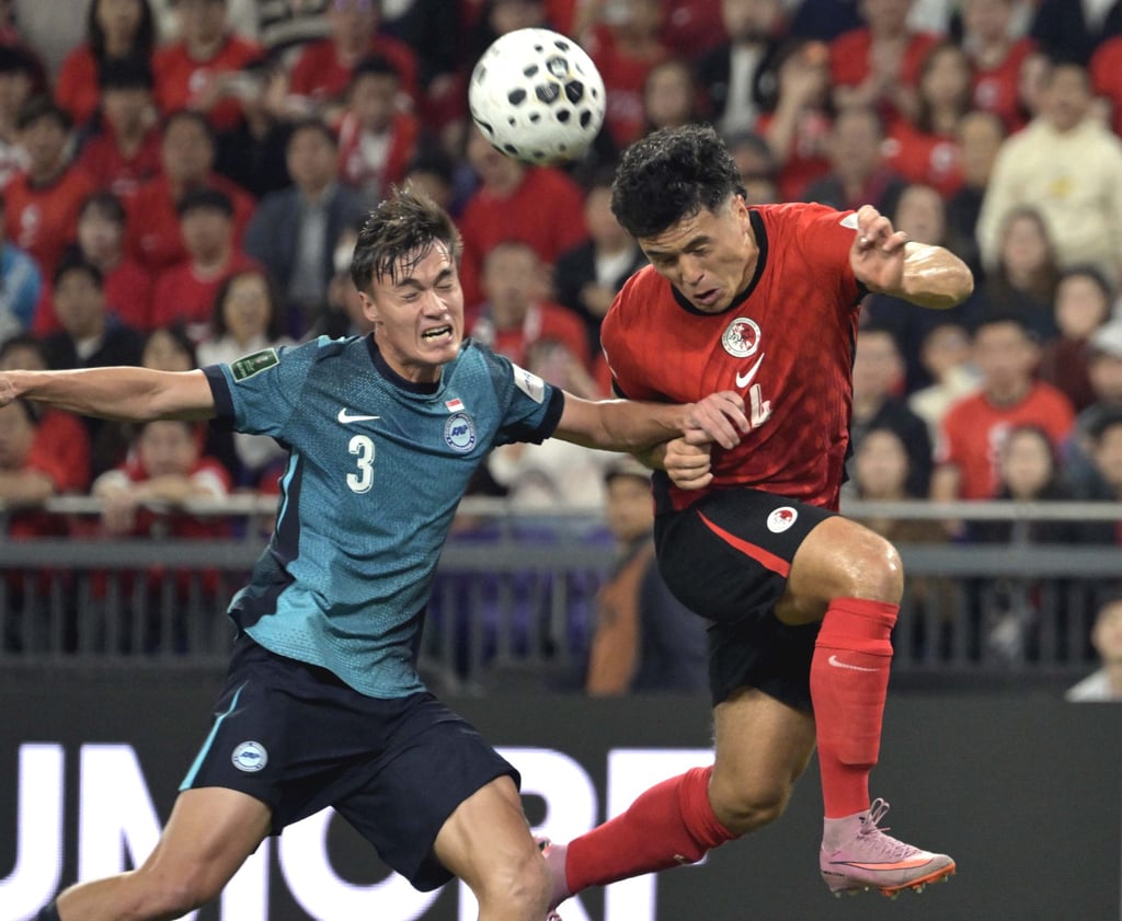 Leon Jones (right) of China’s Hong Kong vies with Ryhan Stewart of Singapore during the AFC Asian Cup 2027 qualifiers football match between Hong Kong and Singapore in Hong Kong on Tuesday. Photo: Xinhua