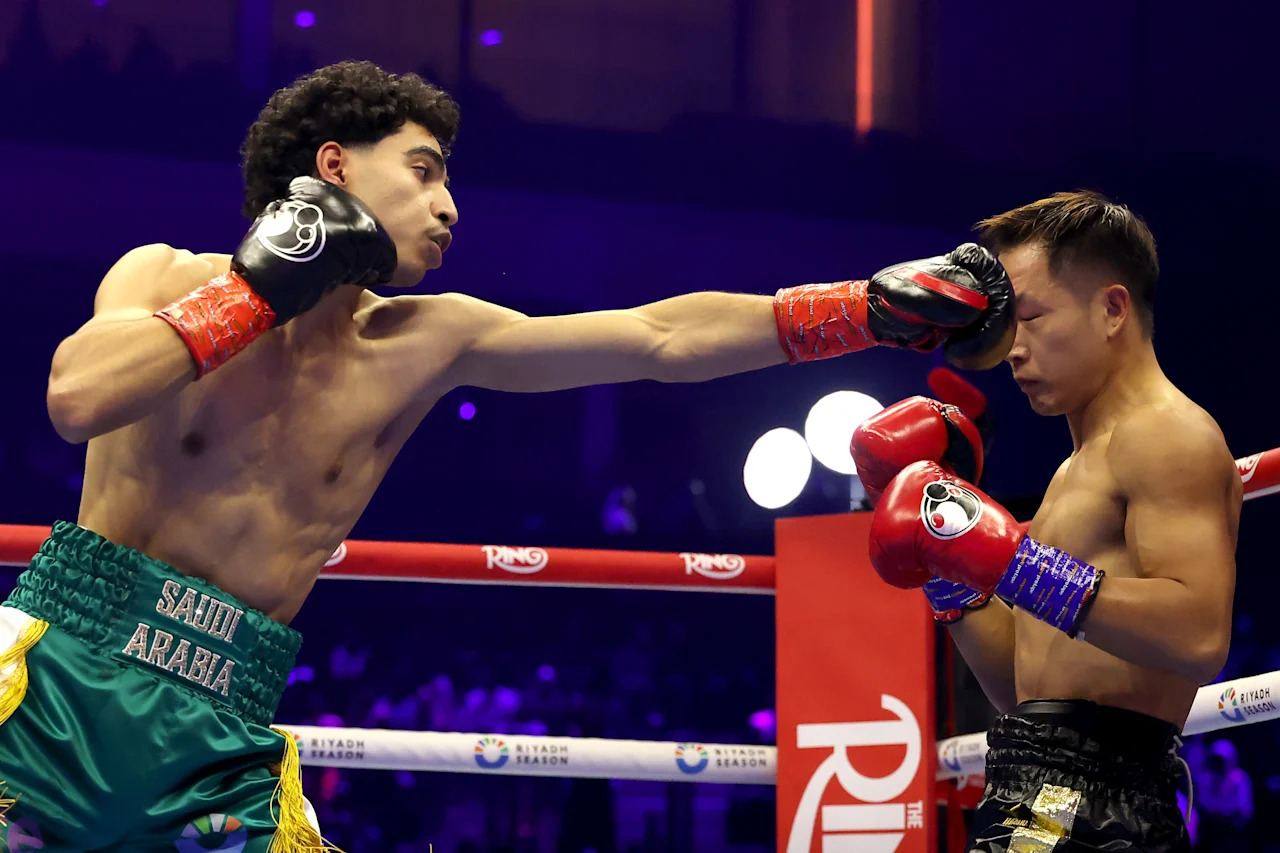 RIYADH, SAUDI ARABIA - NOVEMBER 22: (L-R) Mohammed Alakel punches Jiaming Li in a super-featherweight bout during Ring IV: Night of the Champions at ANB Arena on November 22, 2025 in Riyadh, Saudi Arabia.  (Photo by Richard Pelham/Getty Images)