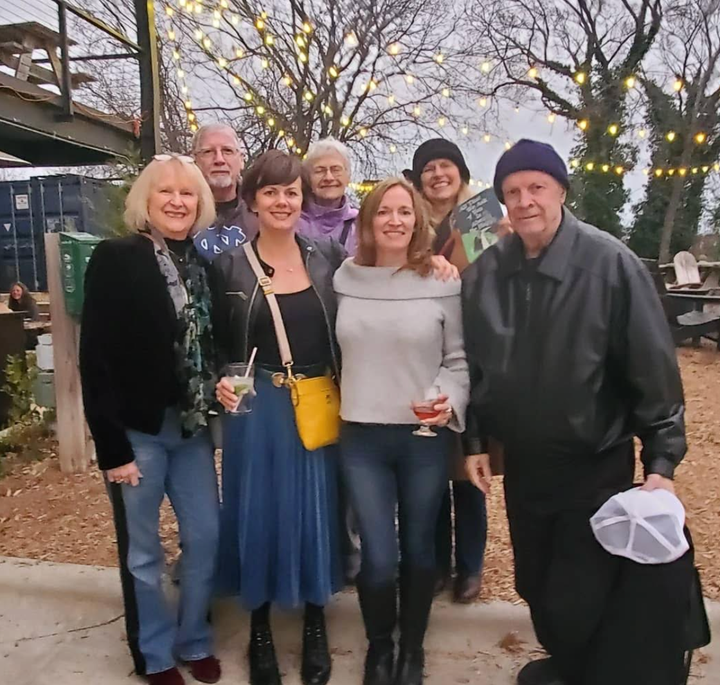 The author (front with yellow bag) and her parents, sister, aunts and uncle at the book launch at Ponysaurus Brewing (Durham, North Carolina, 2025).