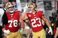 San Francisco 49ers running back Christian McCaffrey celebrates after scoring against the...