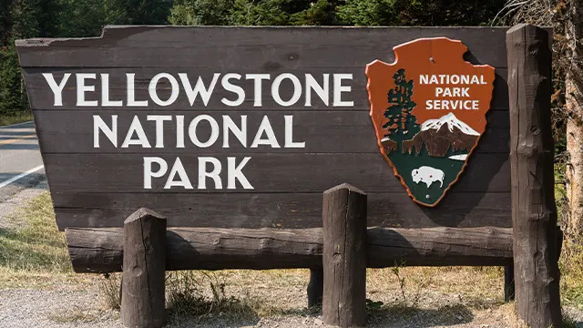 The wooden entrance sign to Yellowstone National Park, USA.. (Photo by: Jon G. Fuller/VWPics/Universal Images Group via Getty Images)