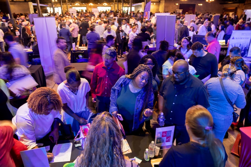 Residents check out the Carter BloodCare booth during the seventh annual "You’re Hired Job...
