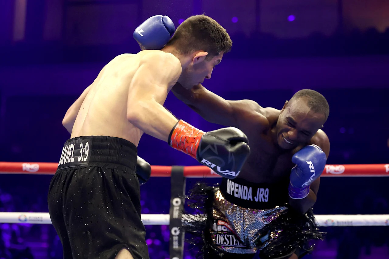 RIYADH, SAUDI ARABIA - NOVEMBER 22: Pius Mpenda (R) punches Julio Porras Ruiz in a super-middleweight bout during Ring IV: Night of the Champions at ANB Arena on November 22, 2025 in Riyadh, Saudi Arabia.  (Photo by Richard Pelham/Getty Images)