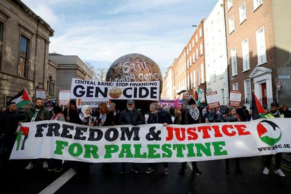 Actor Liam Cunningham leads demonstrators as they hold a banner in support of Palestinians during a march on the International Day of Solidarity, in Dublin, Ireland, on Saturday. Credit: Clodagh Kilcoyne/Reuters Actor Liam Cunningham leads demonstrators as they hold a banner in support of Palestinians during a march on the International Day of Solidarity, in Dublin, Ireland, on Saturday.