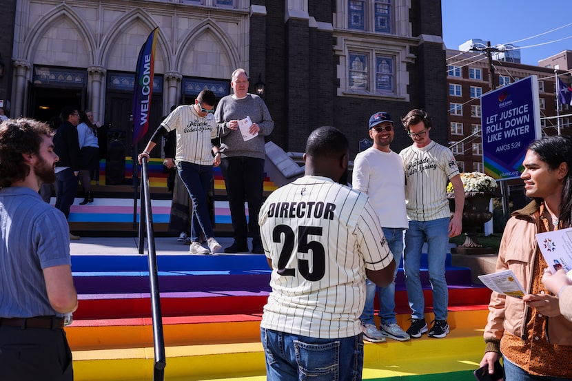 Churchgoers take photos on the rainbow steps at Oak Lawn United Methodist Church on Sunday,...