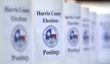 A close-up picture of a Thanksgiving meal on a table, with a turkey, squash, cheese and cranberry sauce.