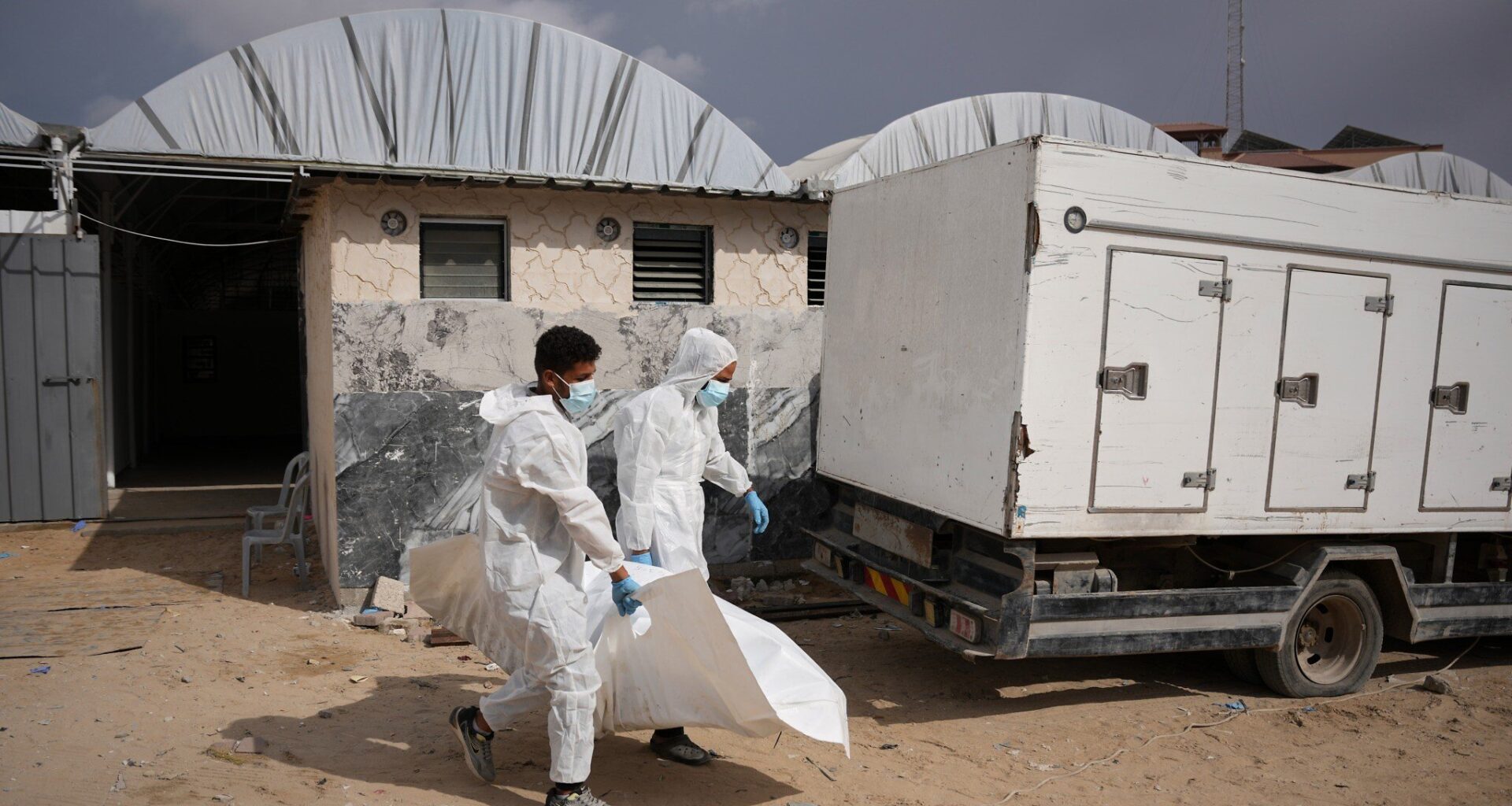 Israel returns 15 Palestinian bodies to Gaza, where displaced families endure winter rains