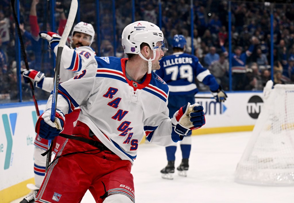 New York Rangers left wing Alexis Lafrenière celebrates his first period goal during the first period of an NHL hockey game against the Tampa Bay Lightning, Wednesday, Nov. 12, 2025, in Tampa, Fla.