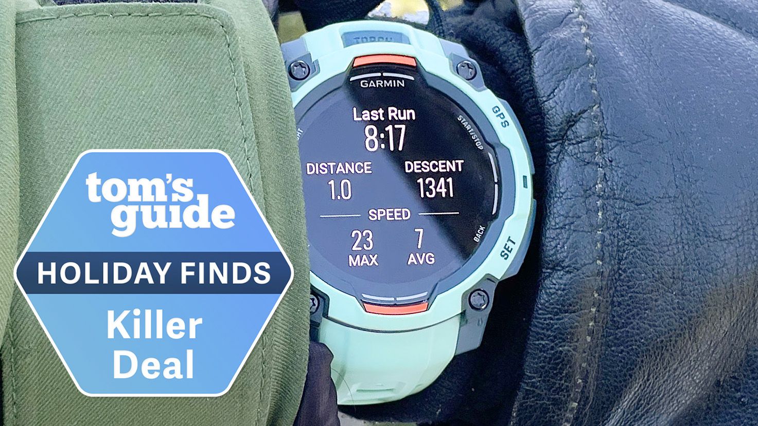 Garmin Instinct 3 close-up on the author's wrist while snowboarding