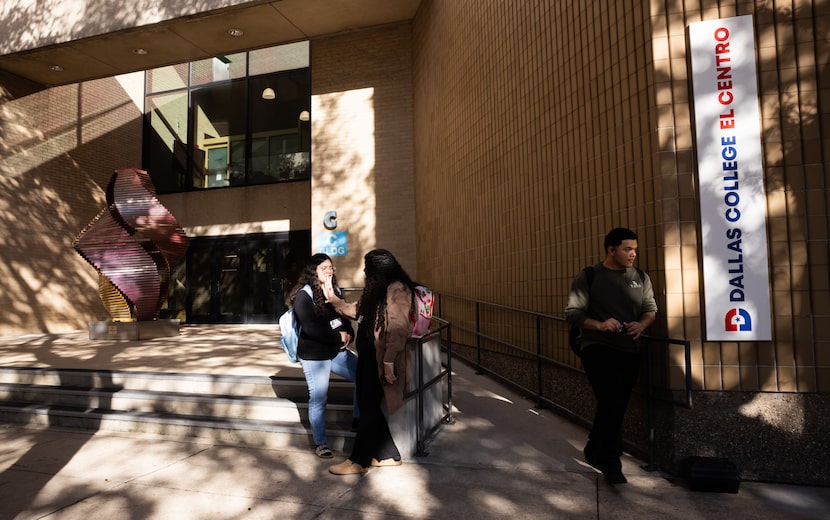 High school students chat and exit outside of the Dallas College’s El Centro Campus in...