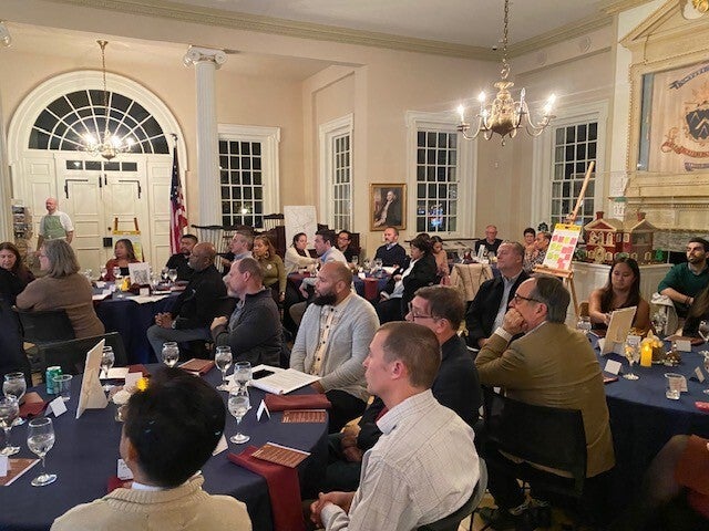 People engaged in a large group discussion