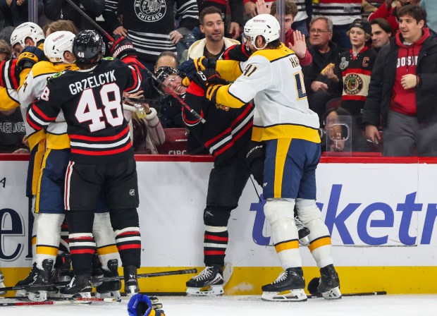 A scrum ensues between the Blackhawks and Nashville Predators during the second period, Nov. 28, 2025, at the United Center. (Dominic Di Palermo/Chicago Tribune)