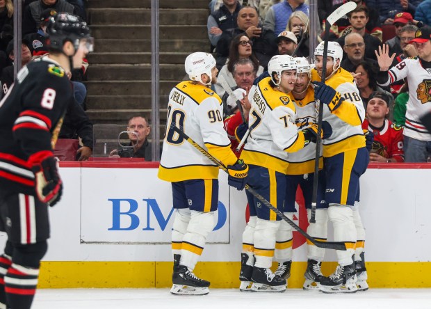 The Nashville predators celebrate Nashville Predators right wing Luke Evangelista's (77) goal that brought the Predators to the lead 3-2 during the second period against the Blackhawks, Nov. 28, 2025, at the United Center. (Dominic Di Palermo/Chicago Tribune)