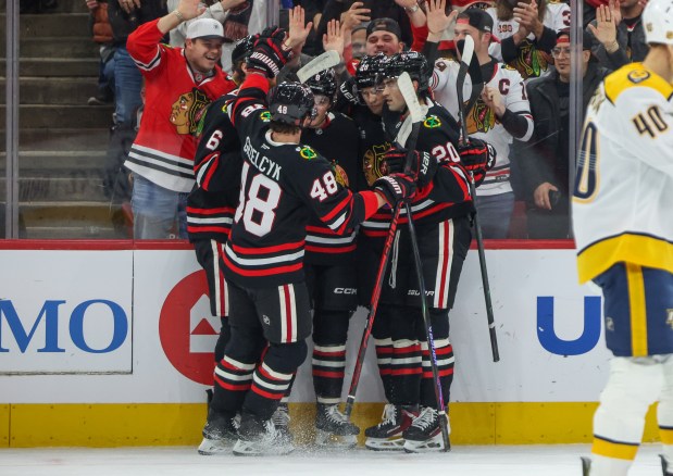 The Blackhawks celebrate Blackhawks center Ryan Donato's goal that brought the score 1-0 during the first period against the Nashville Predators, Nov. 28, 2025, at the United Center. (Dominic Di Palermo/Chicago Tribune)
