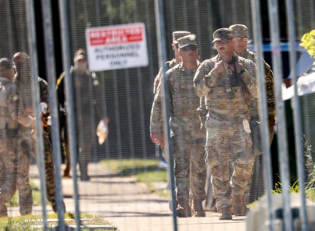 Texas National Guard members patrol outside of the U.S. Immigration and Customs Enforcement holding facility in Broadview on Oct. 9, 2025. (Stacey Wescott/Chicago Tribune)