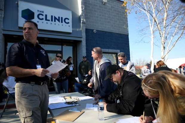 Patients register with The Clinic Mundelein for access to medical marijuana on Nov. 9, 2015, in Mundelein. There was a waiting list of 96 patients when the doors opened. (Brian Nguyen/Chicago Tribune)