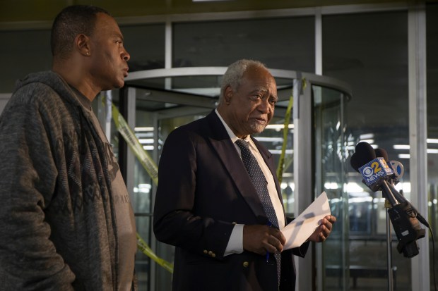 Congressman Danny Davis, right, and his son, Stacey Wilson, speak during a press conference at the 5th District police department, on Nov. 18, 2016, in the Pullman neighborhood. Fifteen-year-old Javon Wilson, the grandson of Danny Davis and son of Stacey Wilson, was shot and killed by two teenagers at his house. (Alyssa Pointer/ Chicago Tribune)