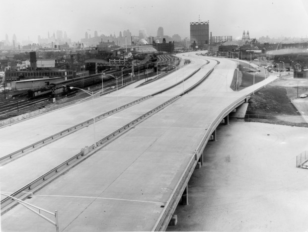 Cars drive a snake-like section of the new Northwest Expressway with downtown Chicago in the background on Oct. 20, 1960. The view is southward from a building at 1735 N. Ashland Ave. At right is a North Avenue outlet. The eight-lane highway was later renamed the Kennedy Expressway. (Jack Mulcahy/Chicago Tribune)