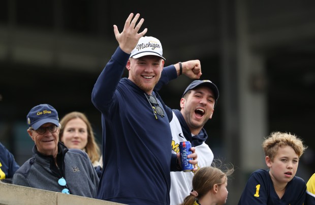 Michigan fans watch the team warm up for a game against Northwestern at Wrigley Field on Nov. 15, 2025, in Chicago. (John J. Kim/Chicago Tribune)