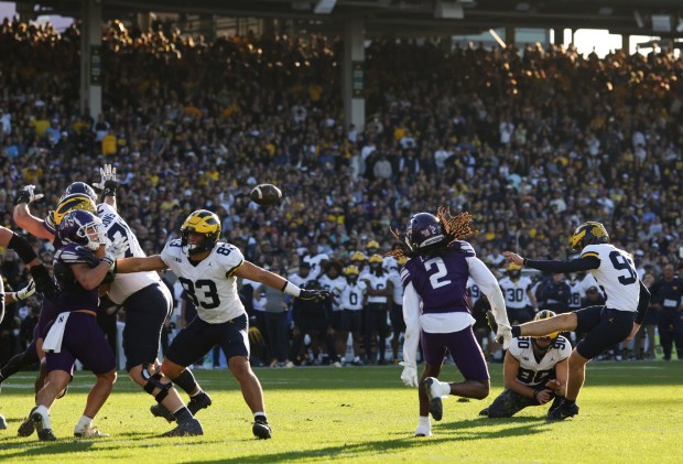 Michigan kicker Dominic Zvada (96) makes a game-winning field goal for a 24-22 win over Northwestern at Wrigley Field on Nov. 15, 2025, in Chicago. (John J. Kim/Chicago Tribune)