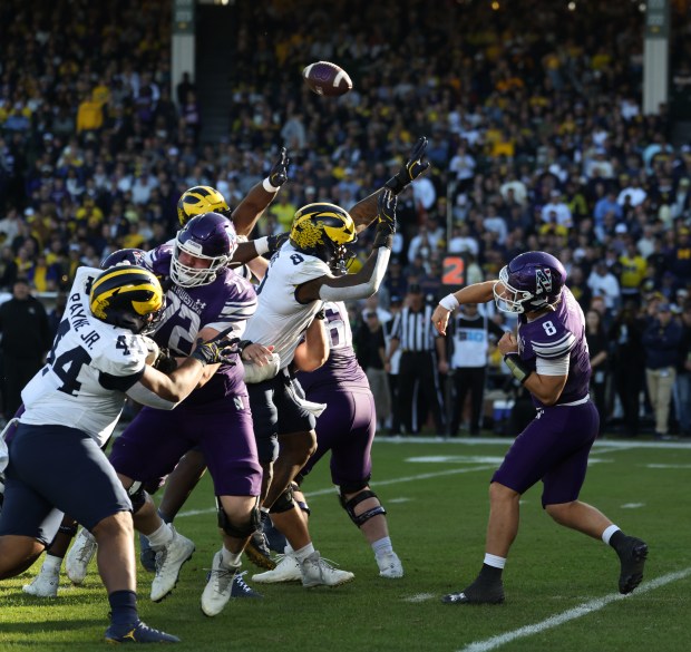 Northwestern quarterback Preston Stone (8) throws in the third quarter against Michigan at Wrigley Field on Nov. 15, 2025, in Chicago. (John J. Kim/Chicago Tribune)