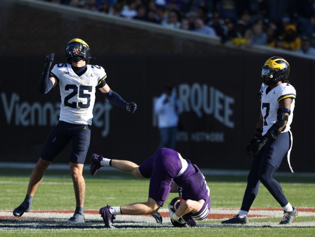 Northwestern wide receiver Griffin Wilde (17) flips after a reception in the third quarter against Michigan at Wrigley Field on Nov. 15, 2025, in Chicago. (John J. Kim/Chicago Tribune)