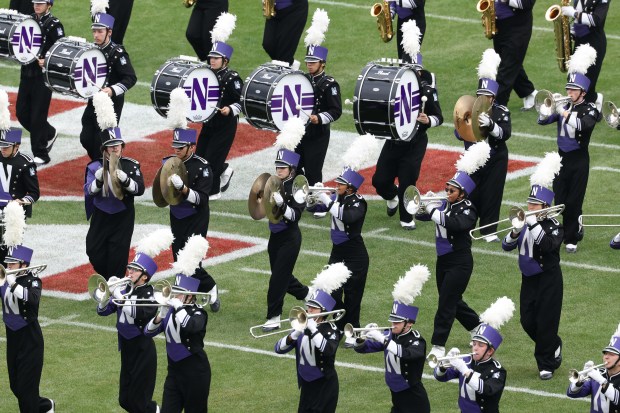 Northwestern marching band members perform before a game against the Michigan at Wrigley Field on Nov. 15, 2025, in Chicago. (John J. Kim/Chicago Tribune)